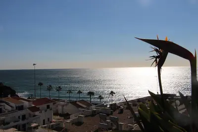 a view of the ocean from a building at Ocean and pool in Olhos de Água