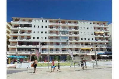 a group of people standing in front of a large building at Quarteira 1-Bed Sleeps 4 Parking 1 min to Beach in Quarteira