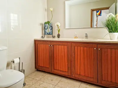 a bathroom with a sink and a mirror at Villa Mar Ali - JACUZZI - 400m from the beach - BY BEDZY in Albufeira