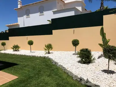 a house with a garden in front of it at Villa Mar Azul in Albufeira