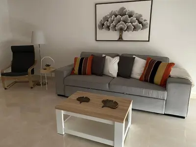 a living room with a couch and a coffee table at Wonderful View - Quinta da Colina C8 in Albufeira