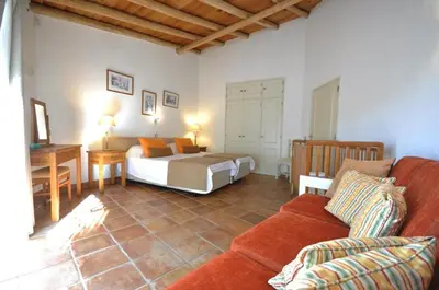 a kitchen and dining room with a table and chairs at Fantastic outdoor area, private pool, Tennis Court Golf Practice Facility in Faro