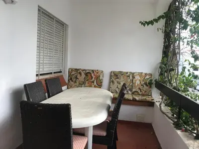 a table and chairs in a room with a window at Comfortable Appartment at Albufeira in Albufeira