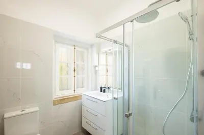 a bathroom with a glass shower and a sink at #049 Villa Lemon by Home Holidays in Albufeira