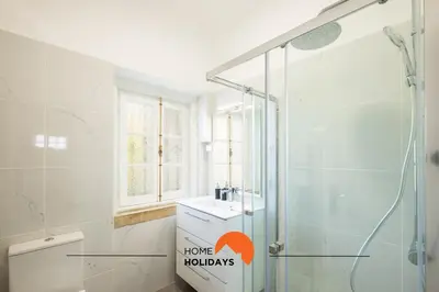 a bathroom with a shower and a toilet and a sink at #049 Villa Lemon by Home Holidays in Albufeira