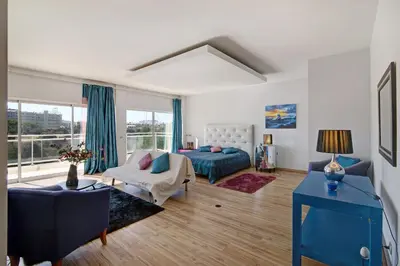 a living room with a bed and a couch at Villa Rosana in Albufeira