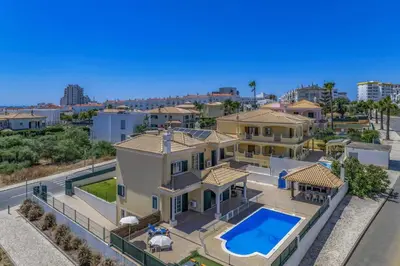 an aerial view of a house with a swimming pool at Villa Carvalho by Villa Plus in Albufeira