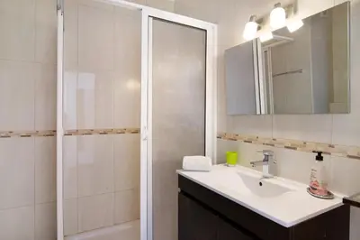 a bathroom with a sink and a shower at T2 Balaia in Albufeira