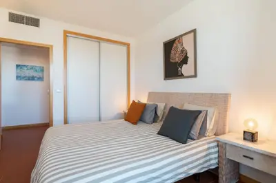 a bedroom with a large bed with pillows on it at RESIDENCE GOLF CLUB by Intiholidays in Vilamoura