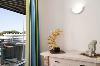 a room with a table with a plant on it at RESIDENCE GOLF CLUB by Intiholidays in Vilamoura