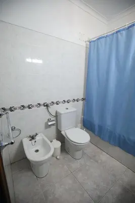 a bathroom with a toilet and a bidet at studio para 2 pessoas in Albufeira