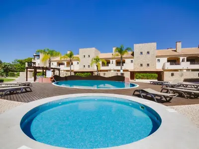 a large swimming pool in front of a resort at AL - Victoria Gardens in Vilamoura