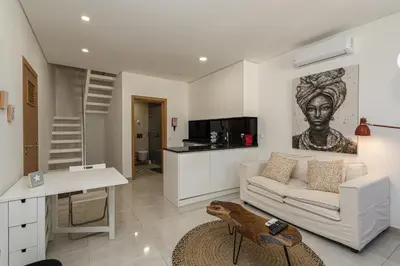 a living room with a couch and a table at Casa da Praca - City Center - Faro in Faro