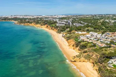 an aerial view of a beach with houses and condos at T2 Eucalipto 2A by Algarneto in Olhos de Água