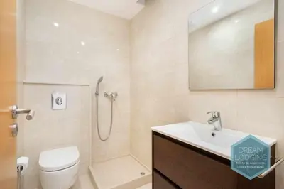 a bathroom with a shower and a toilet and a sink at Patroves Sea View - Dream Lodging in Albufeira