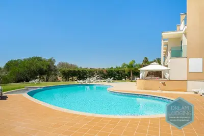 a swimming pool in front of a building at Patroves Sea View - Dream Lodging in Albufeira