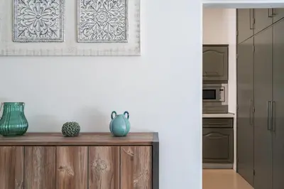 a kitchen with a counter with two vases on it at Villa Macuti by SAPvillas in Vilamoura