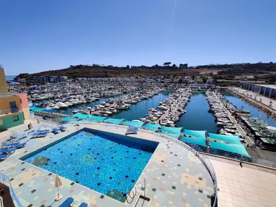 an overhead view of a large pool in a marina at Albufeira Marina Views in Albufeira