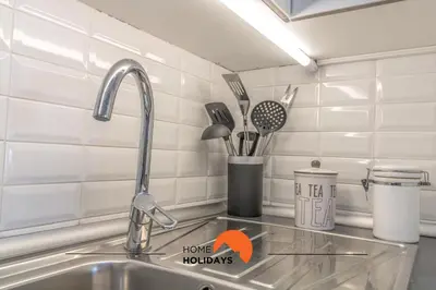 a kitchen sink with a faucet and a counter top at #057 T1 Rossio 43D by Home Holidays in Albufeira