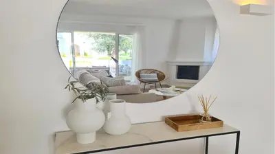 a living room with a mirror and a couch at Vila Chez Lee, 219 Aldeia do Golf-CleverDetails - Sleeps 6, quiet area in Vilamoura
