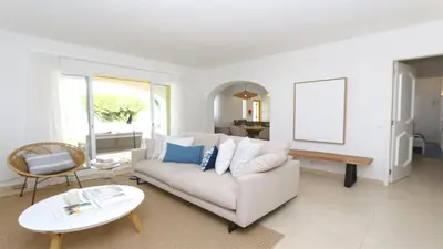 a living room with a white couch and a table at Vila Chez Lee, 219 Aldeia do Golf-CleverDetails - Sleeps 6, quiet area in Vilamoura