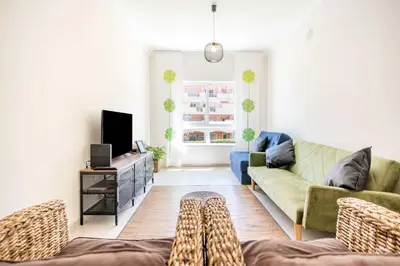 a living room with a couch and a tv at #055 São José V by Home Holidays in Albufeira