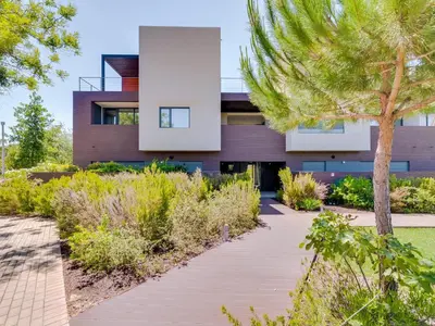a house with a walkway in front of it at L'orangerie modern 1bdr apartment, ground floor in Vilamoura