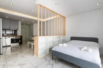 a bathroom with a toilet and a glass shower at #058 T0 Oh Live by Home Holidays in Albufeira