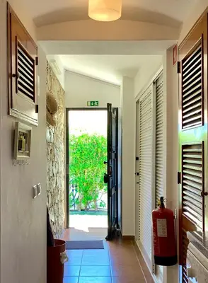a hallway with a door leading to a yard at LOTUS VILLA 2, ALBUFEIRA in Albufeira