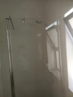 a shower with a glass door in a bathroom at Casa do Algarve in Albufeira