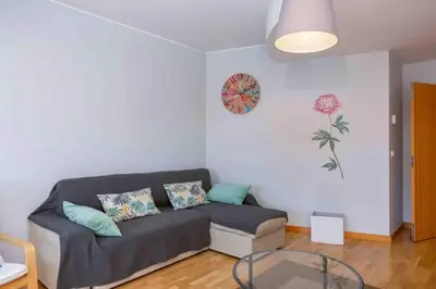 a living room with a couch and a glass table at Admirable 1 bedroom Marina view apt. Albufeira in Albufeira