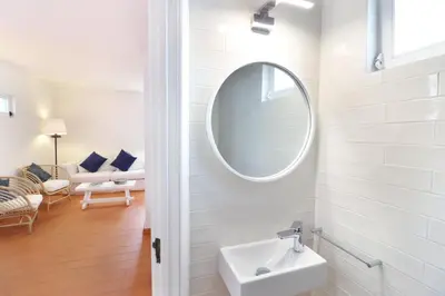 a bathroom with a sink and a mirror at Seagull Rooftop Beach @150 m in Vale do Lobo