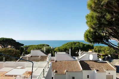 a view of the ocean from the roofs of houses at Casa Allan in Vale do Lobo