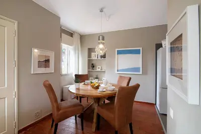 a dining room with a table and chairs at Villa Apfel in Vale do Lobo