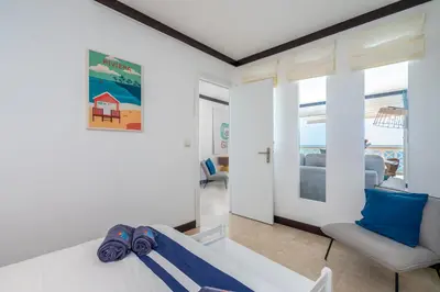 a living room with a couch and a table at Aveiros by the Sea by Intiholidays in Albufeira