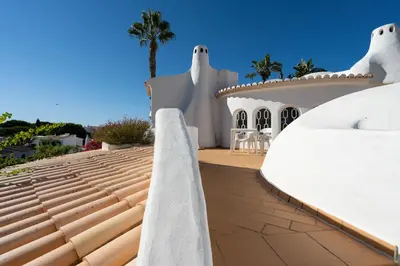 a view of a house with a roof at Casa de Gales - Vilamoura in Vilamoura