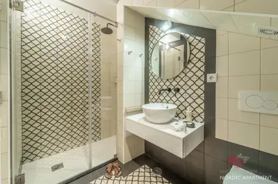 a bathroom with a sink and a mirror at 7 Styles Apartments by Raspberry Cascade in Faro