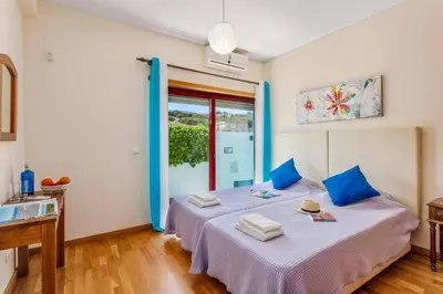 a outdoor kitchen with a fire grill in a yard at Villa Marina Azul by Villa Plus in Albufeira