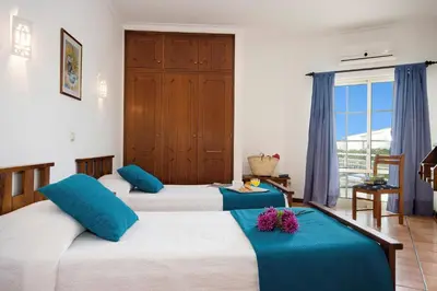 two beds in a room with blue and white at Villa Primavera by Villa Plus in Albufeira