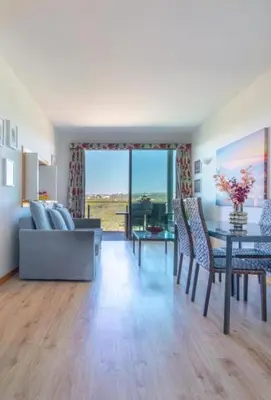 a living room with a couch and a table at Residence Golf Club-Vilamoura-Algarve in Vilamoura
