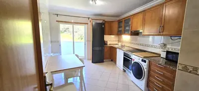 a hallway with a room with a drawer and a door at Holidays - Albufeira in Albufeira