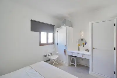 a white bedroom with a desk and a sink at Apt 1 Quarto, Piscina, AC, Varanda, Prestige For Home in Vilamoura