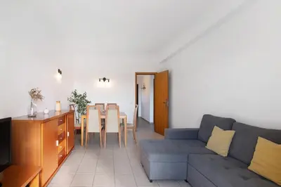 a living room with a couch and a table at T1 Apartamentos Vista Alegre in Albufeira