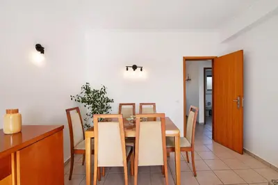 a dining room with a table and chairs at T1 Apartamentos Vista Alegre in Albufeira
