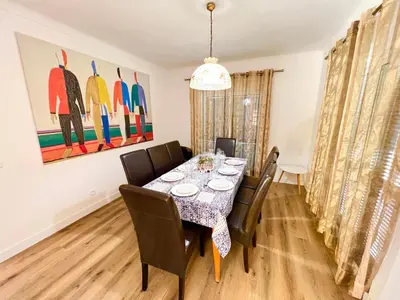 a dining room with a table and chairs at Vila Sophia, Vilamoura- By Urbinvest Algarve in Vilamoura