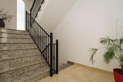 a bedroom with a large bed and a window at Casa Rosa - Heated Pool & Sea Views in Loulé