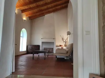 a living room with a couch and a fireplace at Villa 3 Quartos, Piscina, AC, Vista Mar, Prestige For Home in Loulé