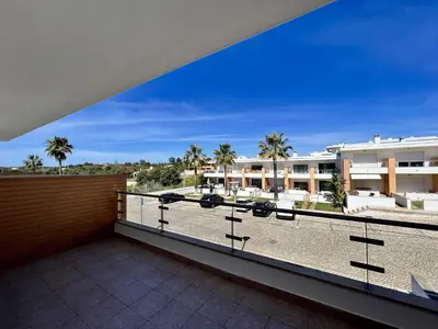 a balcony with a view of a building at Albufeira Garden Villa With Pool by Homing in Albufeira