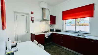 a hallway with a fire extinguisher on the wall at Vital by Check-in Portugal in Albufeira
