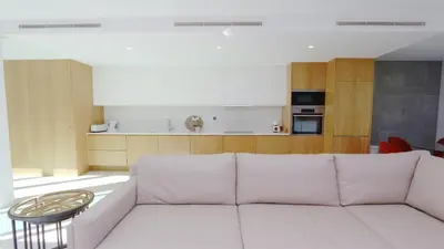 a living room with a white couch and a table at Villa Terese-CleverDetails, Central Vilamoura, Sleeps 6, luxury, walking distance in Vilamoura